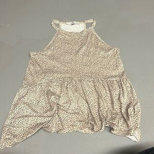 This is a tank top from gaze it has a nice tan and black print on it.